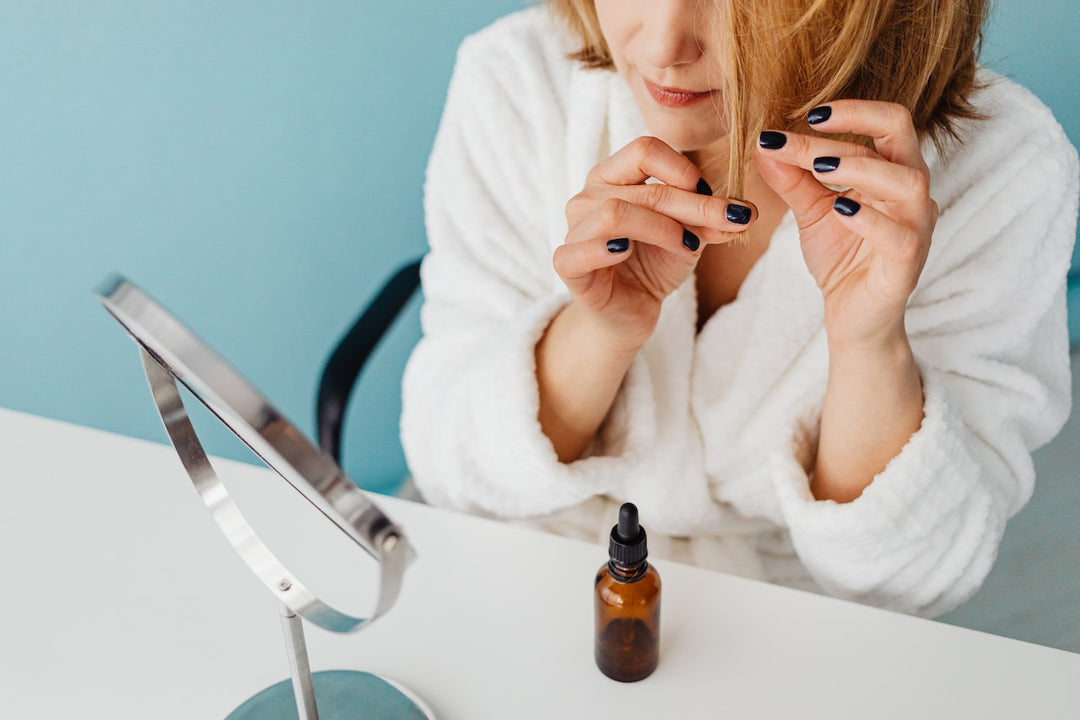 woman applying hair care product