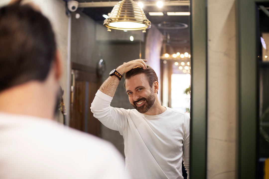 man fixing hair