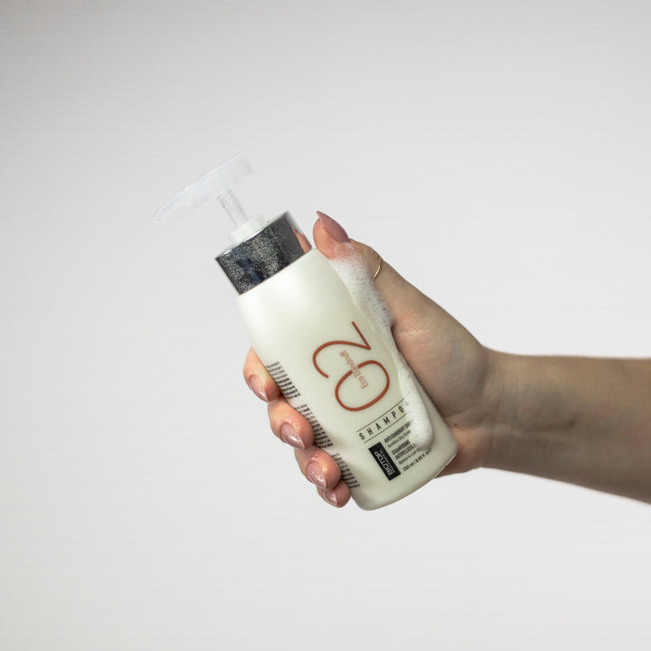 Biotop 02 Eco Dandruff Shampoo - bottle in hand