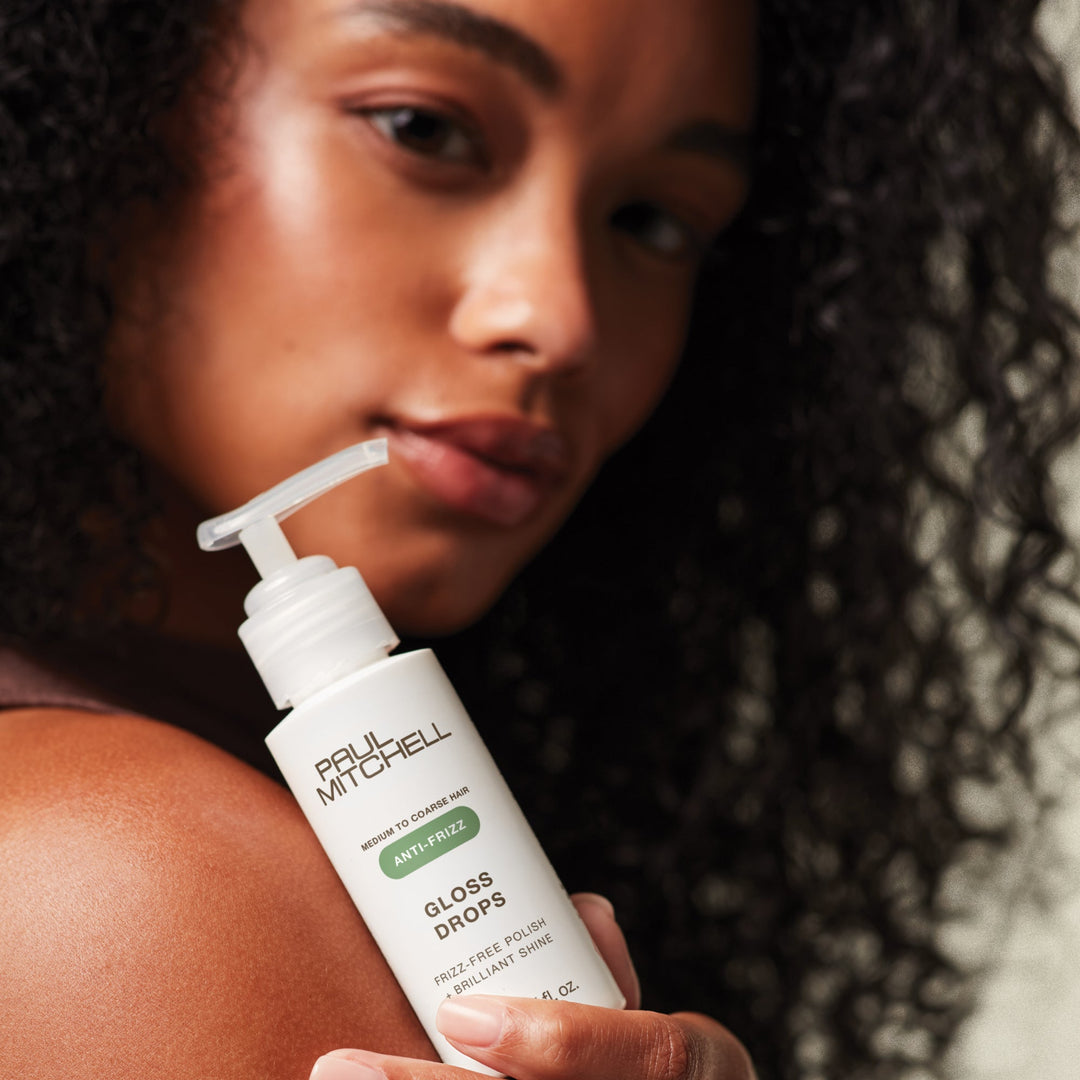 Paul Mitchell Gloss Drops - model with bottle