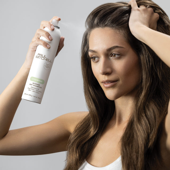 Paul Mitchell Intense Dry Shampoo - model applying the spray