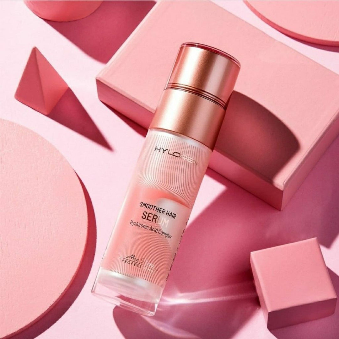 Mon Platin Hyloren Smoother Hair Serum - bottle styled on pink shapes