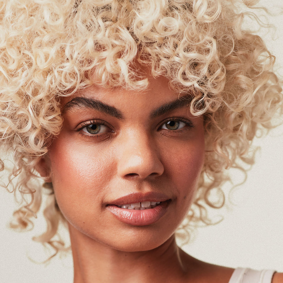 Paul Mitchell Platinum Blonde Violet Shampoo - model with cool blonde hair