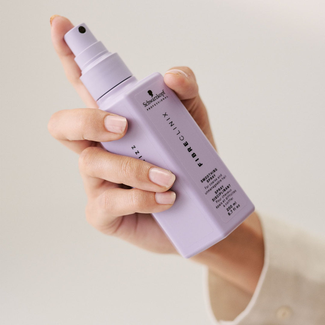 Schwarzkopf Fibre Clinix De-Frizz Smoothing Spray - bottle in hand