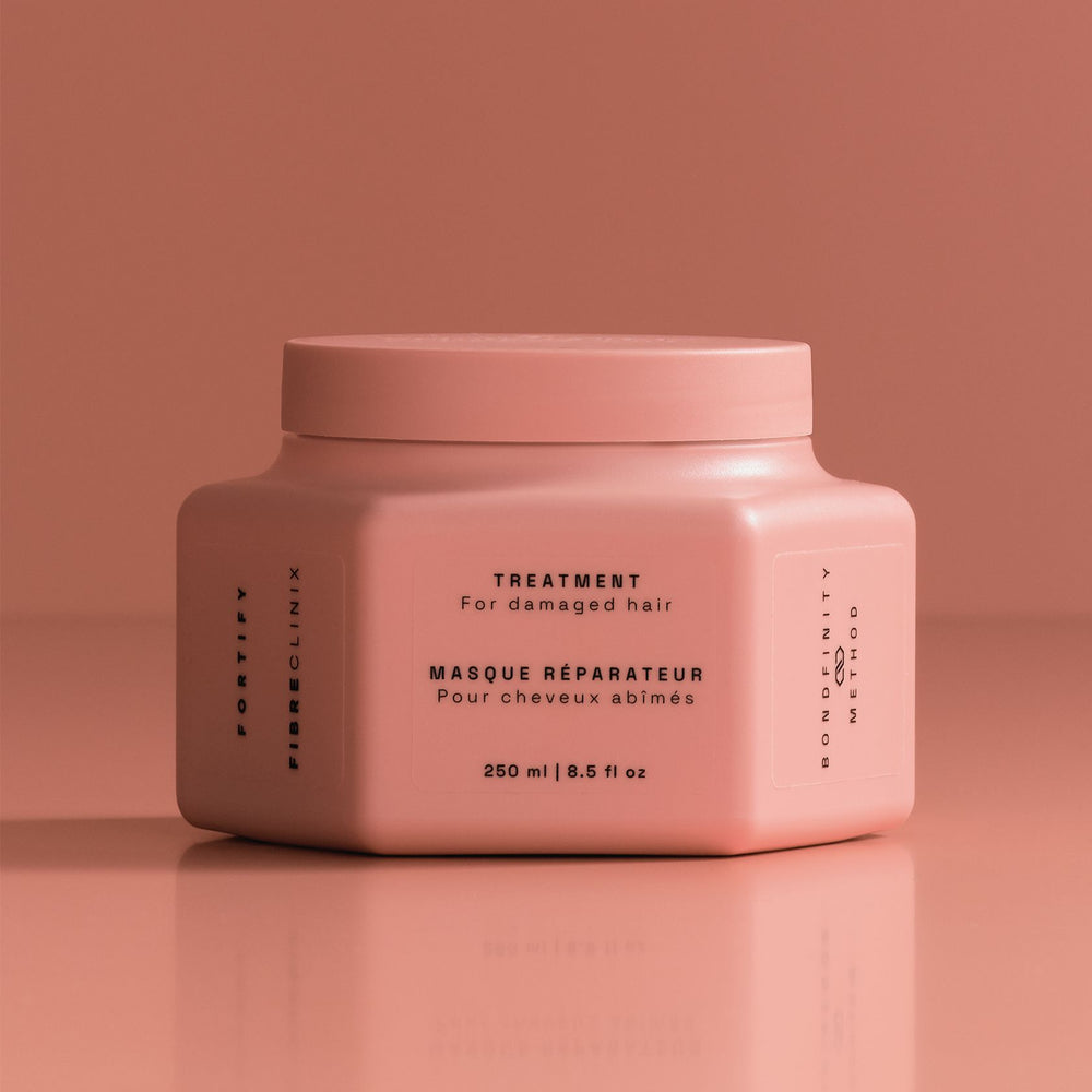 Schwarzkopf Fibre Clinix Fortify Treatment - jar on coral backdrop