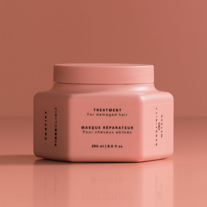 Schwarzkopf Fibre Clinix Fortify Treatment - jar on coral backdrop