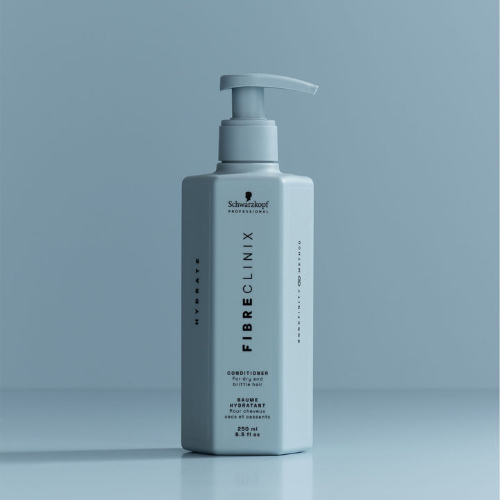 Schwarzkopf Fibre Clinix Hydrate Conditioner - bottle on blue backdrop