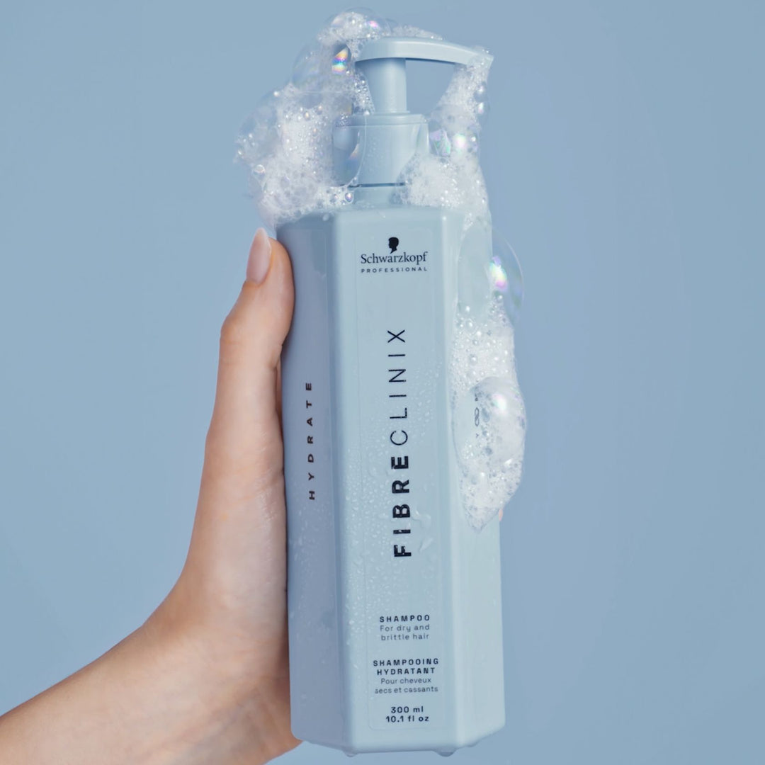 Schwarzkopf Fibre Clinix Hydrate Shampoo - bottle with lather in hand
