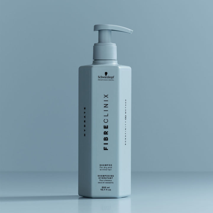 Schwarzkopf Fibre Clinix Hydrate Shampoo - bottle on blue backdrop