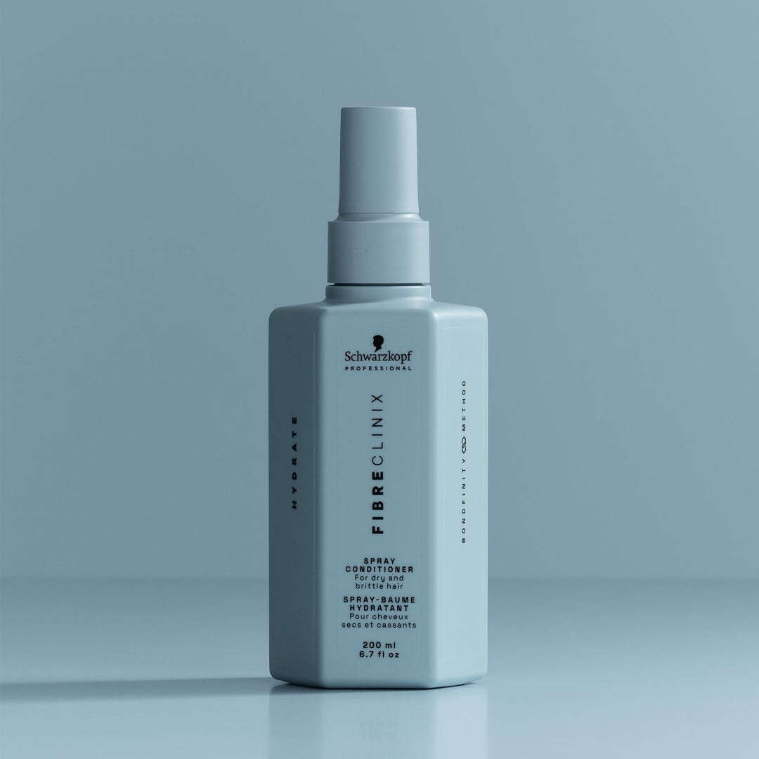 Schwarzkopf Fibre Clinix Hydrate Spray Conditioner - bottle on blue backdrop