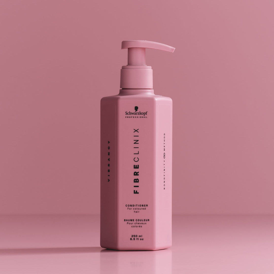 Schwarzkopf Fibre Clinix Vibrancy Conditioner - bottle on pink backdrop