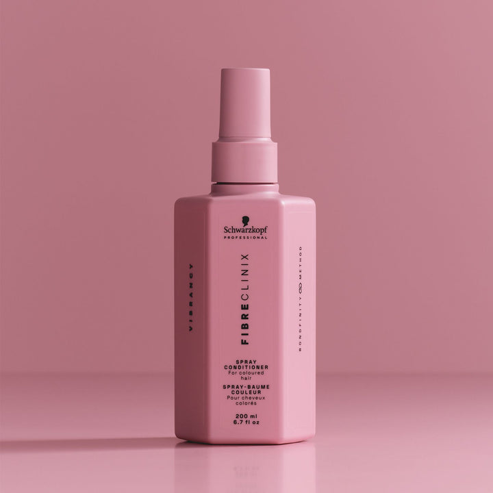 Schwarzkopf Fibre Clinix Vibrancy Spray Conditioner - bottle on pink backdrop
