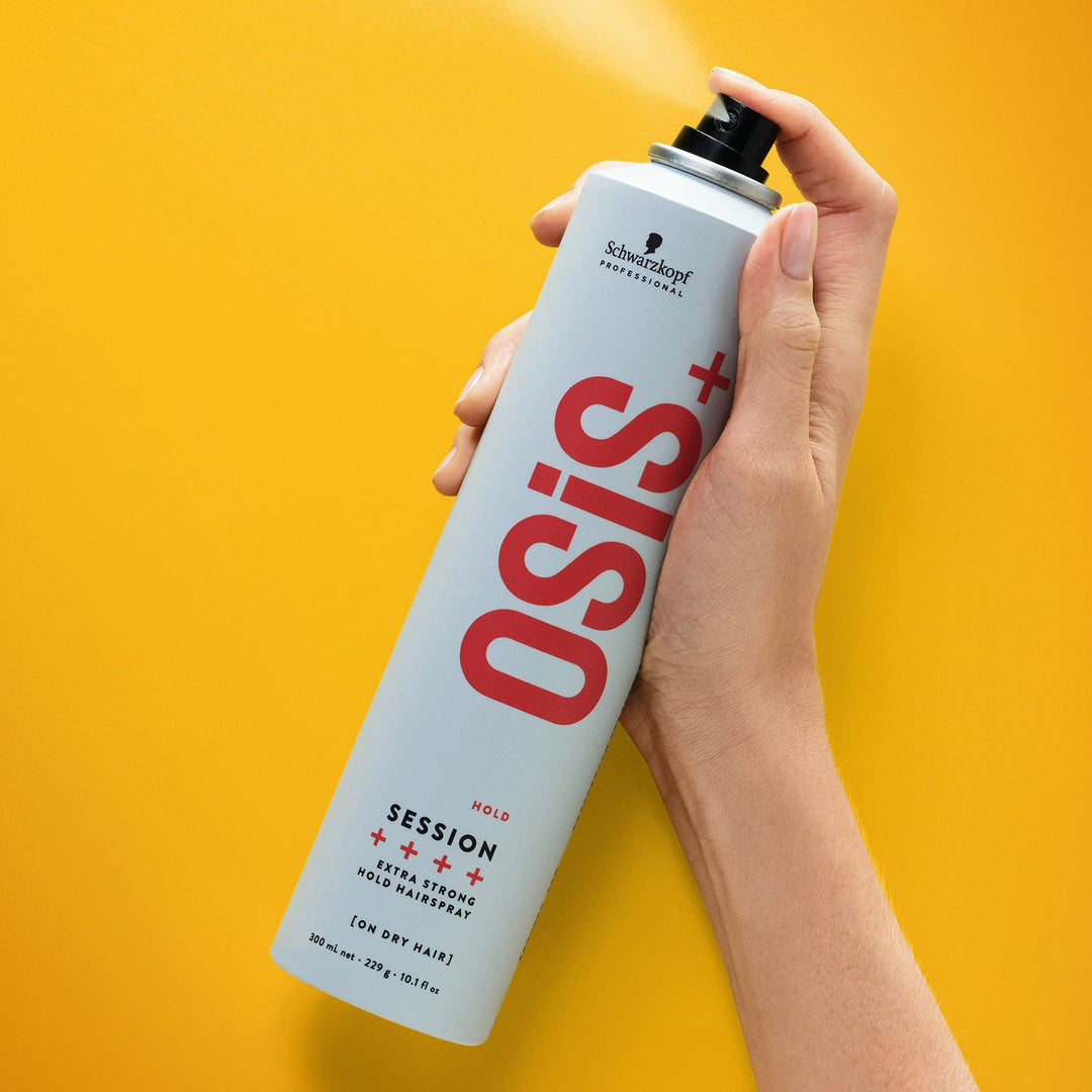 Hand spraying Schwarzkopf OSiS+ Session Extra Strong Hold Hairspray