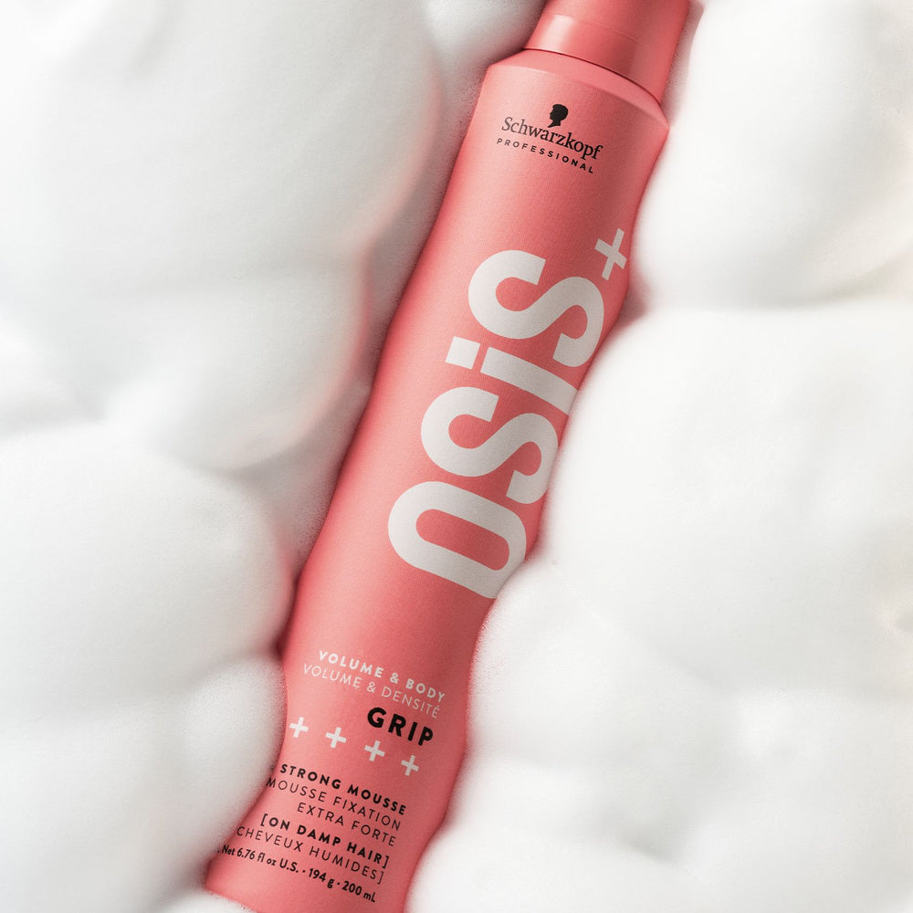 Schwarzkopf OSiS+ Grip Extra Strong Mousse can resting on white mousse foam