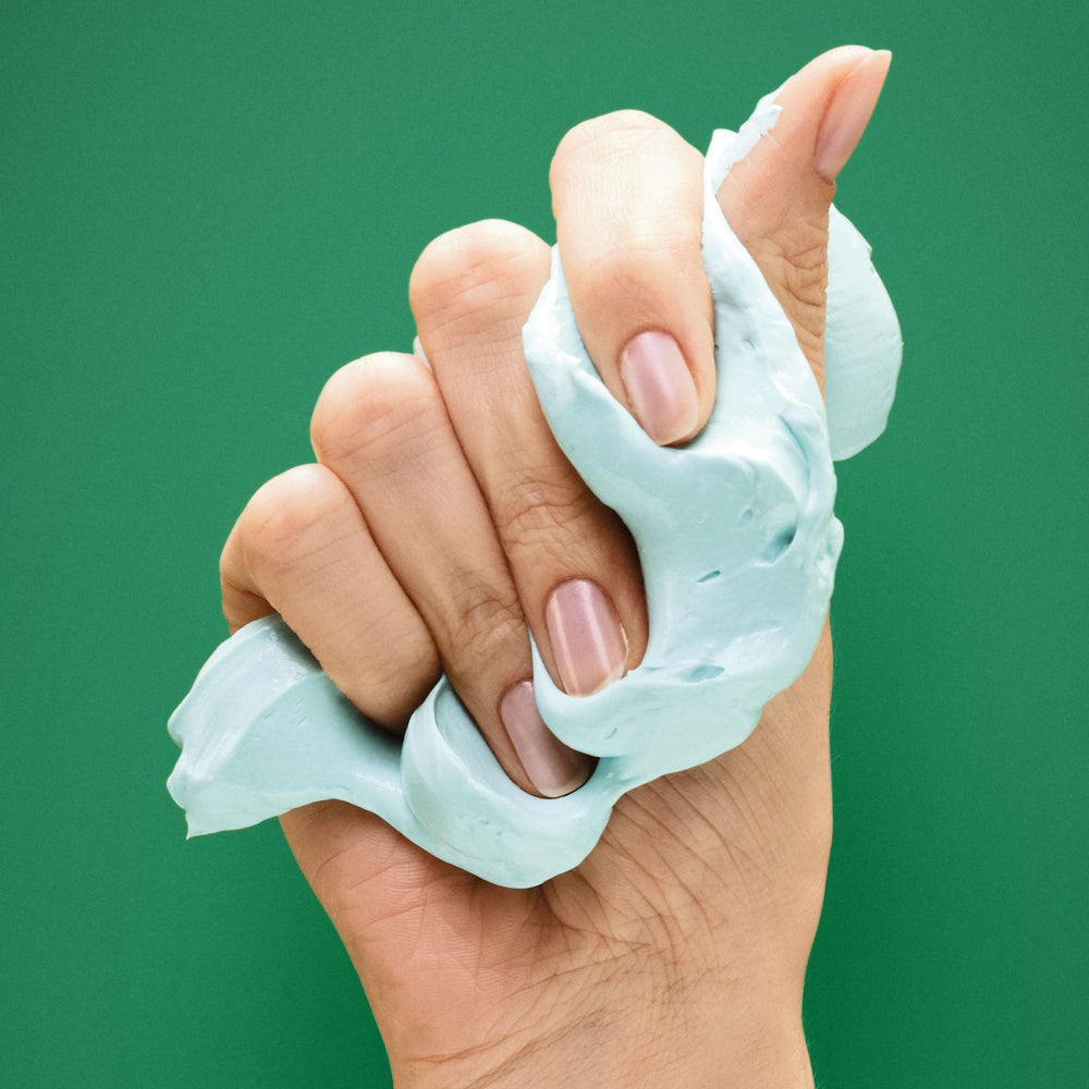 OSiS+ Mighty Matte cream texture squeezed in hand