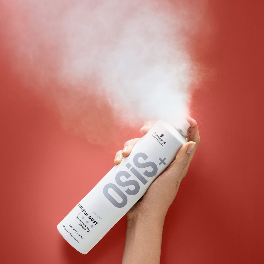 OSiS+ Refresh Dust Bodifying Dry Shampoo spraying a fine powder mist