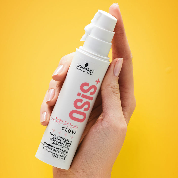 Hand holding Schwarzkopf OSiS+ Glow Frizz Control & Shine Serum 50 ml
