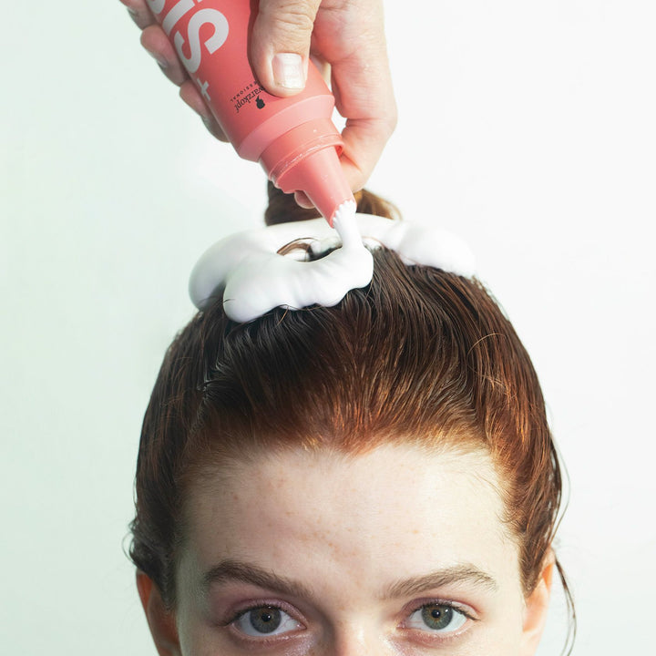 OSiS+ Air Whip mousse being applied to damp hair