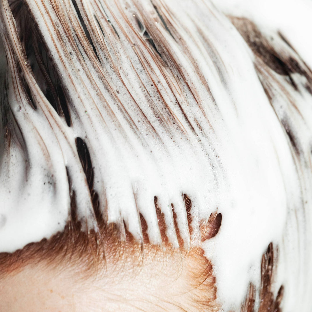 OSiS+ Grip mousse worked through damp hair before blow-drying