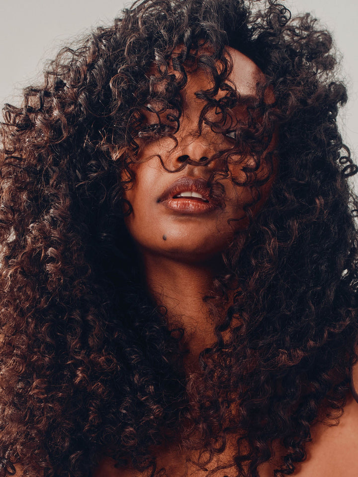 AG Xtramoist Moisturizing Shampoo - model with hydrated curls