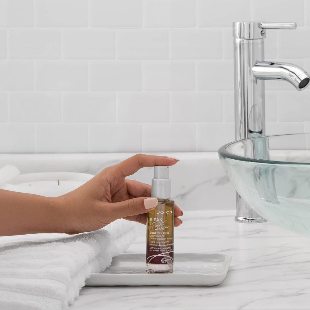 Joico K-PAK Color Therapy Luster Lock Glossing Oil - lifestyle: pump bottle on bathroom vanity
