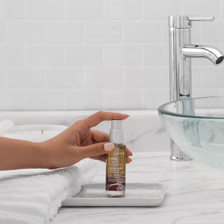 Joico K-PAK Color Therapy Luster Lock Glossing Oil - lifestyle: pump bottle on bathroom vanity